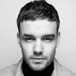 Premium Deluxe LP1 Album cover featuring a close-up portrait of a man with short hair and neutral expression in monochrome.